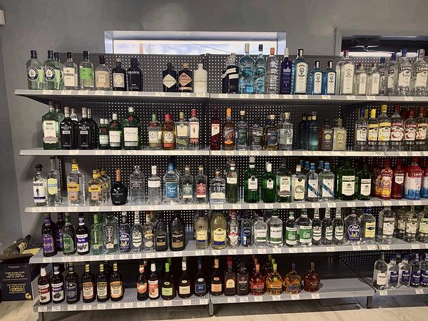 Shelves of clear and flavored spirits