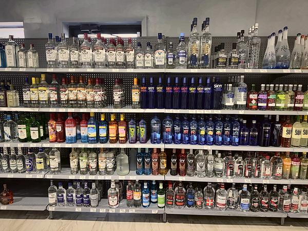 Vodka shelves, from large bottles on top to smaller sizes below