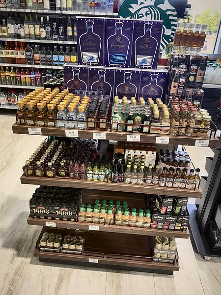 Display stand stocked with miniature bottles and gift packs