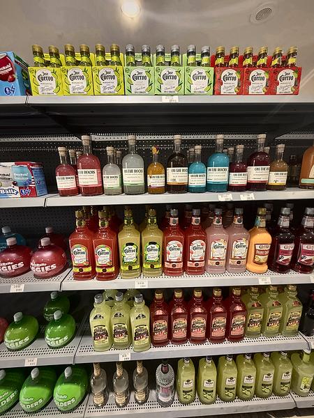 Colorful shelves of ready-to-drink cocktails and mixes