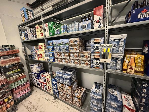 Corner of the beer section with cases and packs