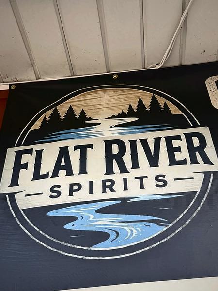 Flat River Spirits banner with the store's river-and-pines logo