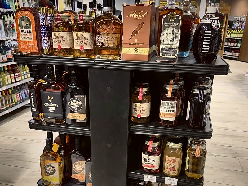 Featured whiskey island with bottles including Detroit City bourbon